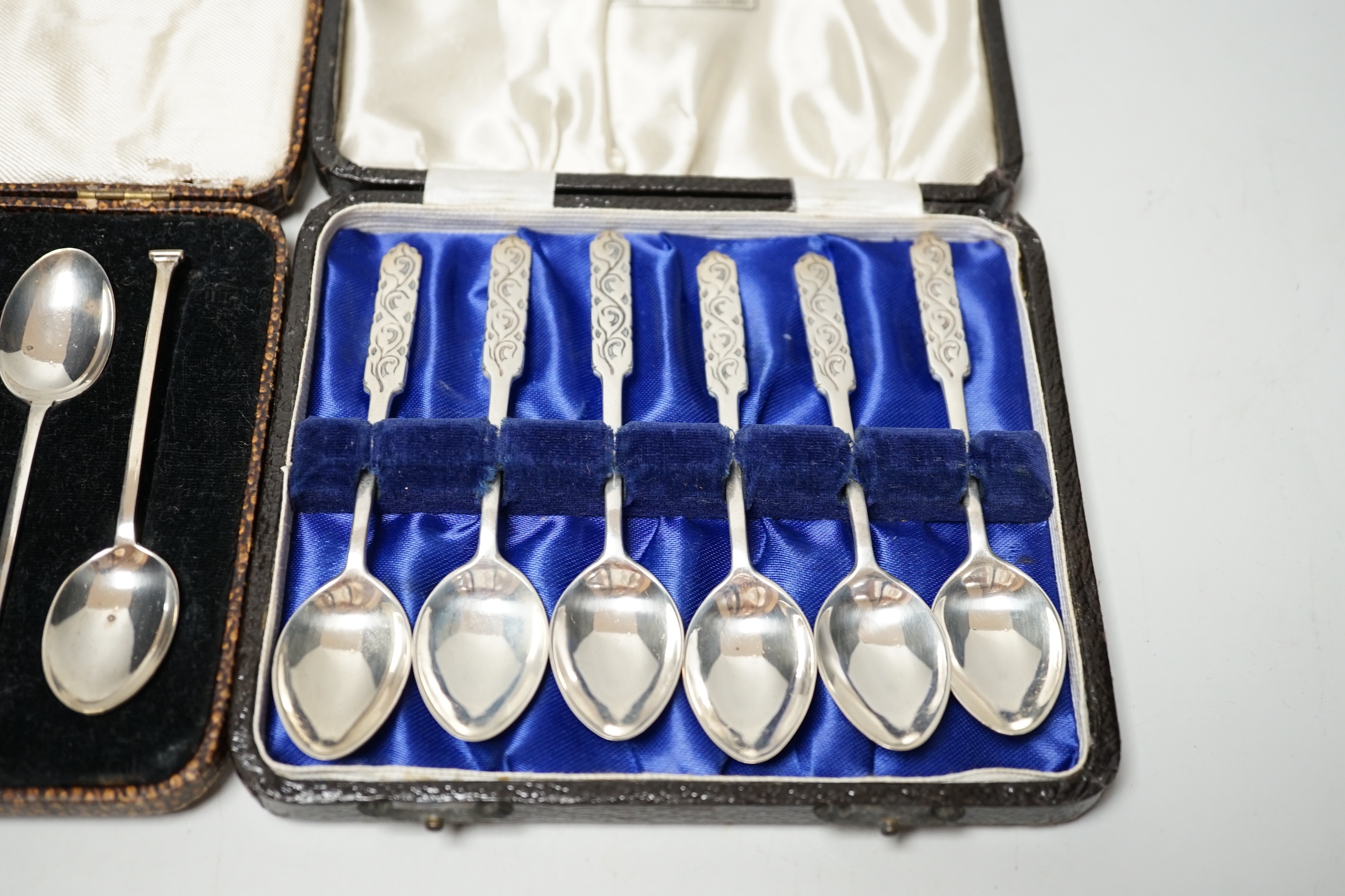 Two cased sets of six silver teaspoons including J.A. Restall Ltd, Birmingham, 1945, retailed by Liberty & Co.